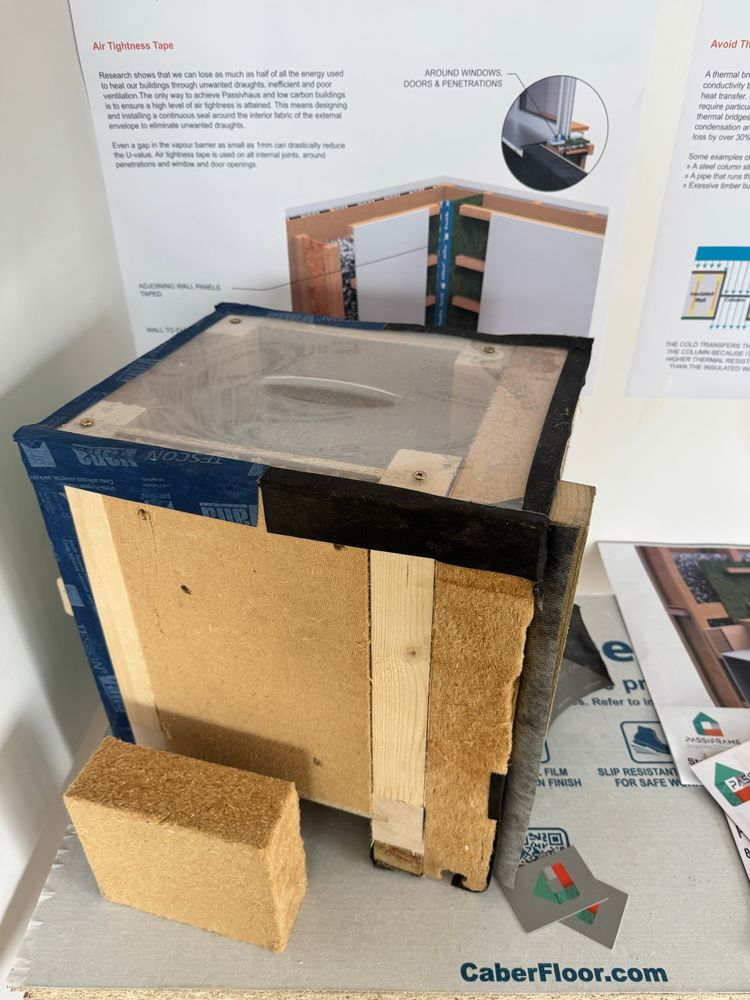 Model of a high performance wall assembly using timber I-beams, woodfibre board, air tightness board and blown in cellulose insulation 