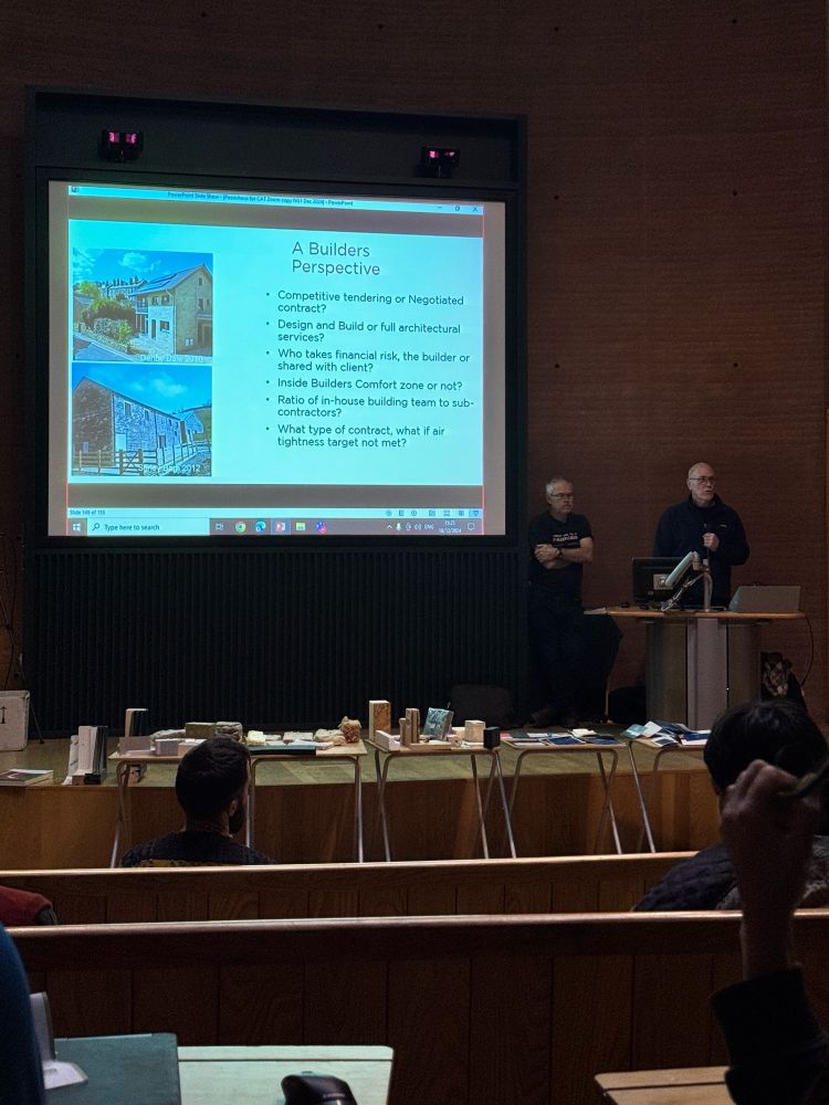 Photo of the lecture theatre at the Centre for Alternative Technology, Nick Grant and Bill Butcher sharing their experiences of good building design