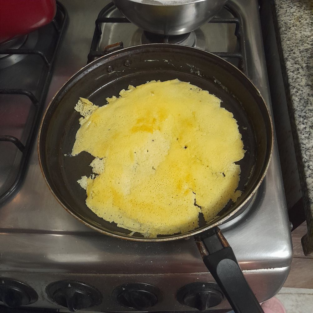 Ugly pancake being fried