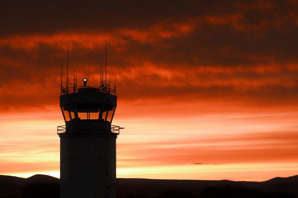 ATC tower with a sunrise behind 
