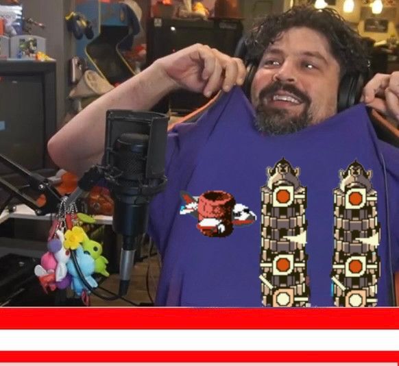 Jeff Grubb wearing a purple shirt depicting Funky Kong being a terrorist. 