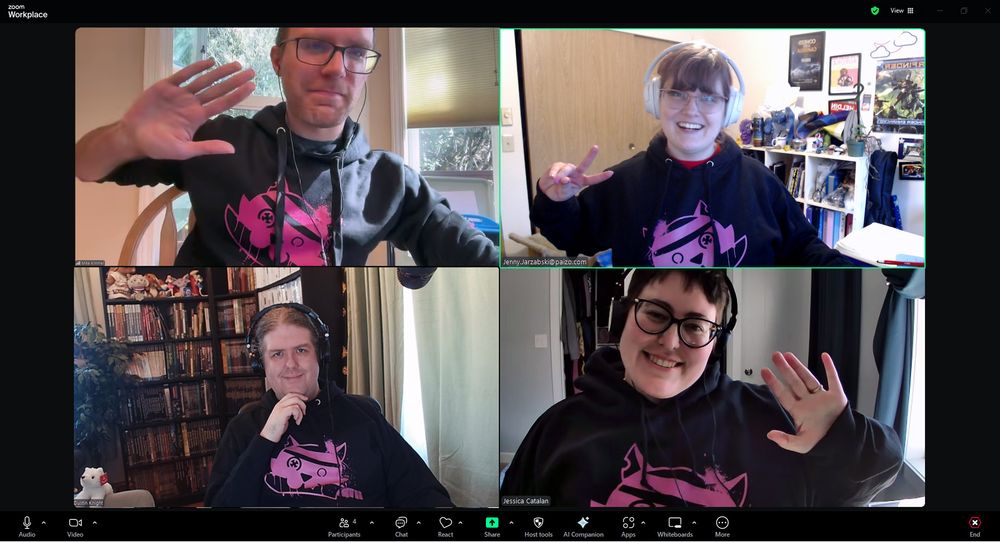 The Starfinder team at Paizo during a work call wearing our Galaxy Guide hoodies!