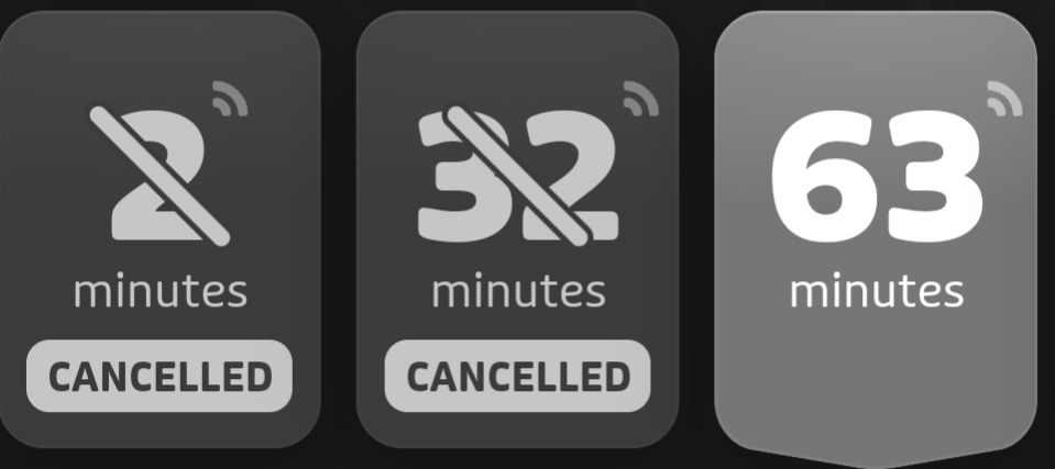 transit app screenshot cropped to display three bus times: 2 minutes (CANCELLED), 32 minutes (CANCELLED), 63 minutes (real time tracking 👍)