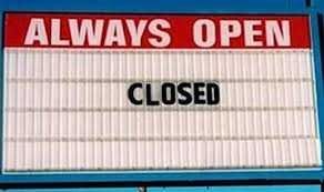 A shop declaring itself as always open, only to show a closed sign.