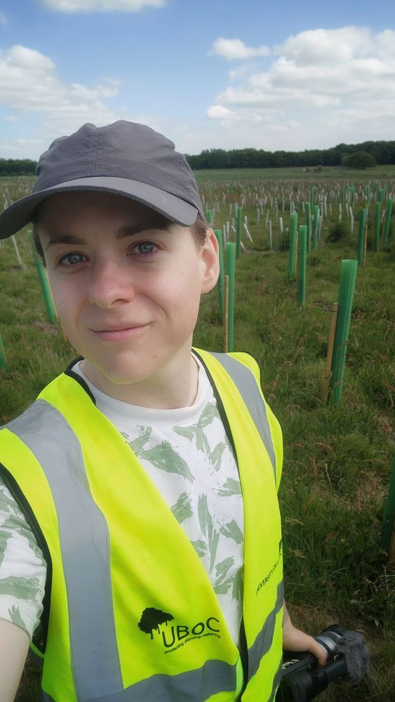 me in a hi-vis jacket in a field of planted trees