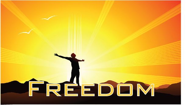 With the rising sun in the background, a person stands on a mountain top with arms outstretched as if free and victorious. Captioned with the word FREEDOM. 