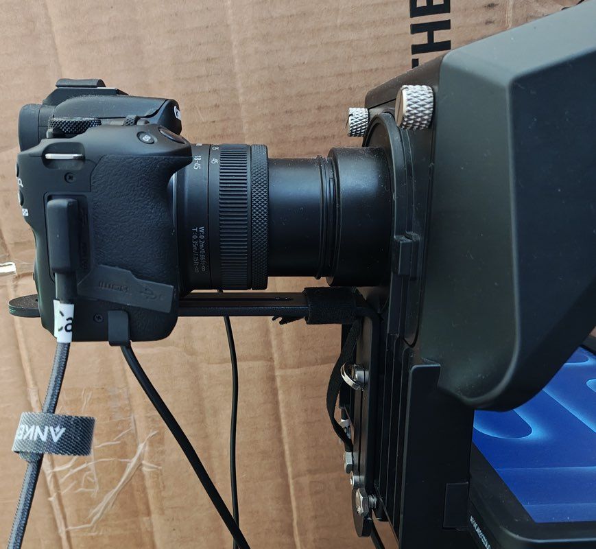 Photo of the bracket connecting my Canon R50 Camera to the Elgato Teleprompter that I use for both a webcam and YouTube recording setup.