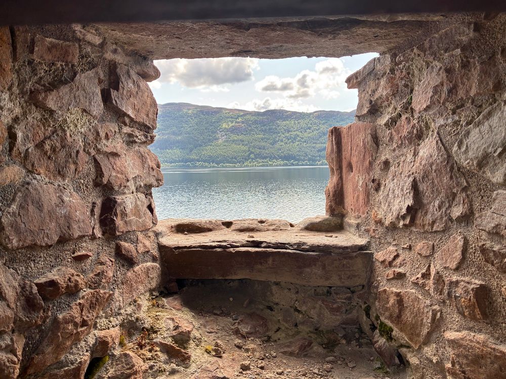 Looking out on the deepest portion of Loch Ness from a window in Grant Tower. It’s well over 700 feet deep out there! The opposite shore can been seen, and the shot is framed by the castle’s ruined window.