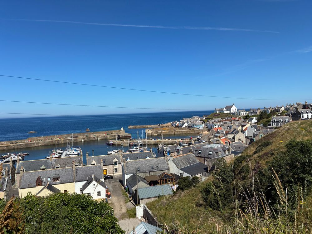 Overview of Findochty from the small bluff above the also small harbor. The three seawalls (and dogleg entrance, and scary rock next to the outer entrance) can be seen. I did this entrance at night! 