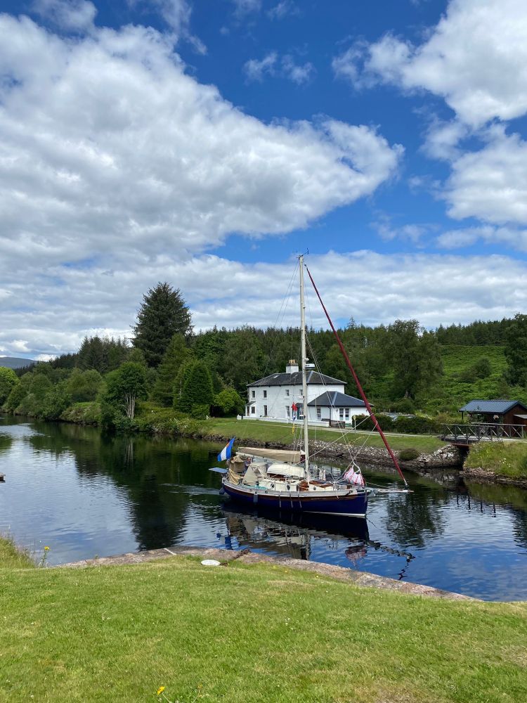 Indigo cruising down the canal between Loch Ness and Loch Oich.