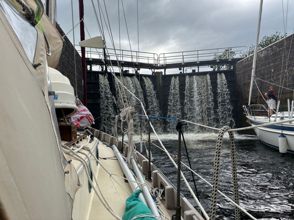 A veritable water fall of water fills the lock just ahead of Indigo.