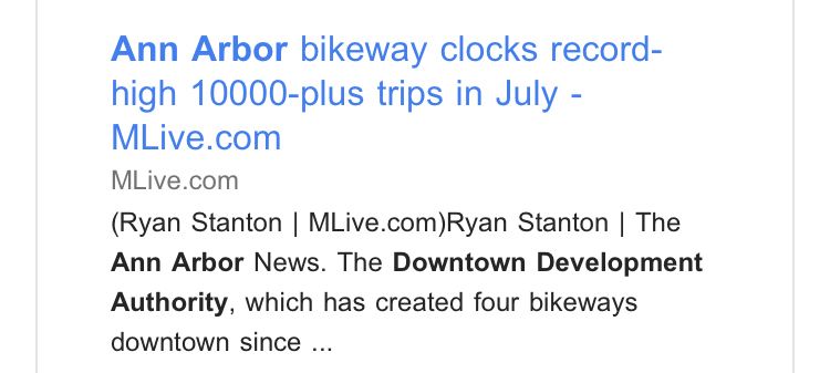 Screenshot of a news article titled “Ann Arbor bikeway clicks record-high 10,000-plus trips in July.”
