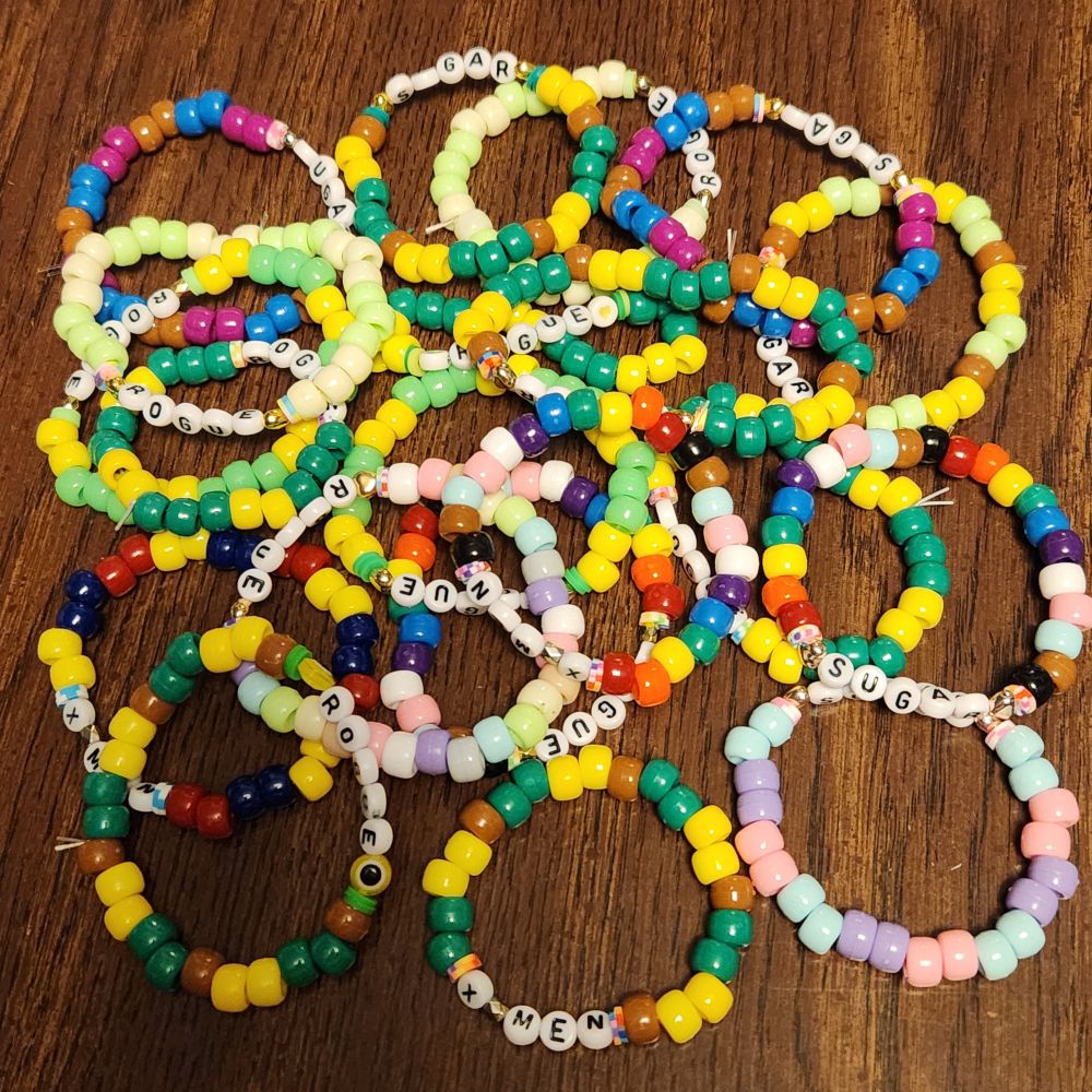 Beaded friendship bracelets.  Most say Rogue while others say Xmen or Sugar. 