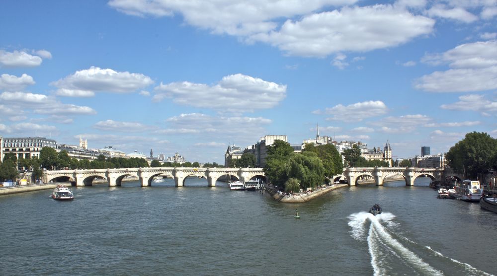 A recent photograph of Pont Neuf with the Île de la Cité in between the two different sections. 