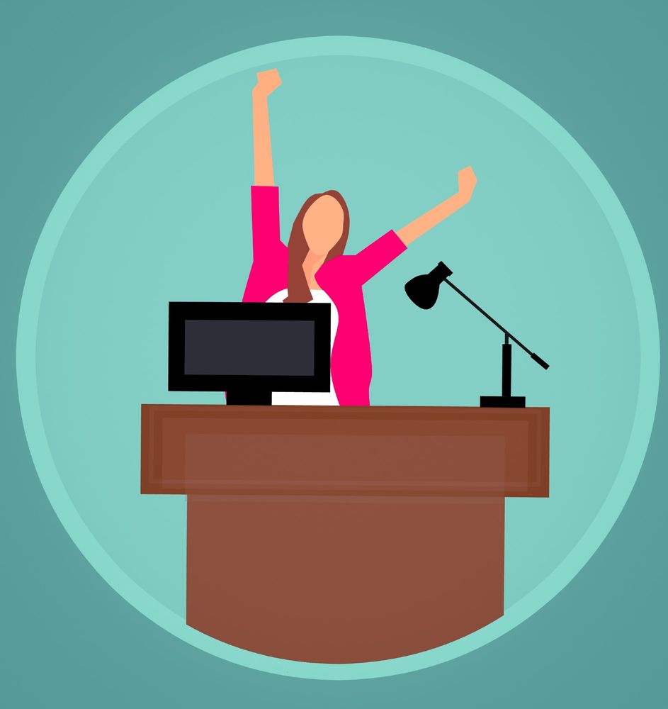 Cartoon of a faceless woman wearing a pink jacket, behind a brown lectern with a monitor and a lamp. The woman has brown hair and is stretching her arms upwards. 
Downloaded from Stockvault.net. 
Author: Mohamed Hassan, under creative commons CC0.