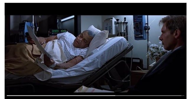 Admiral Grier in a hospital bed