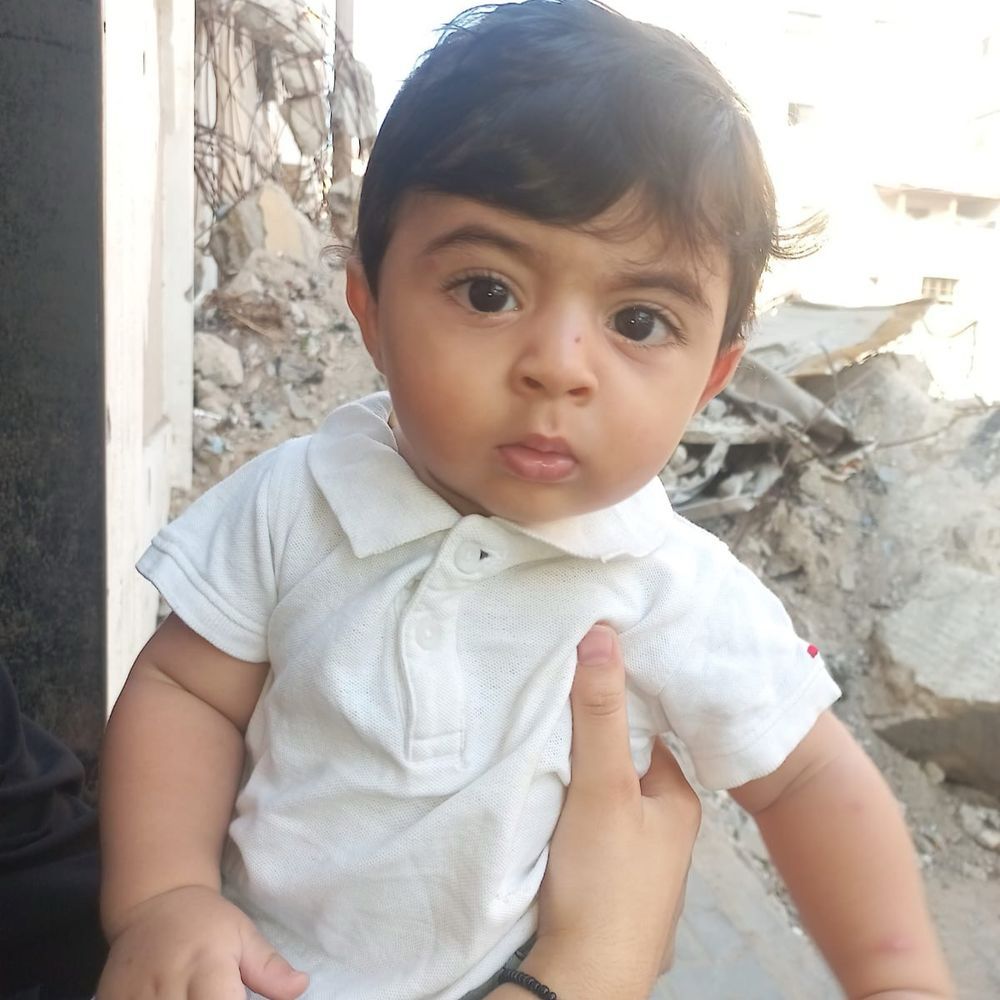 A Photo of the baby Yaman, the youngest child of the family. Born in war.