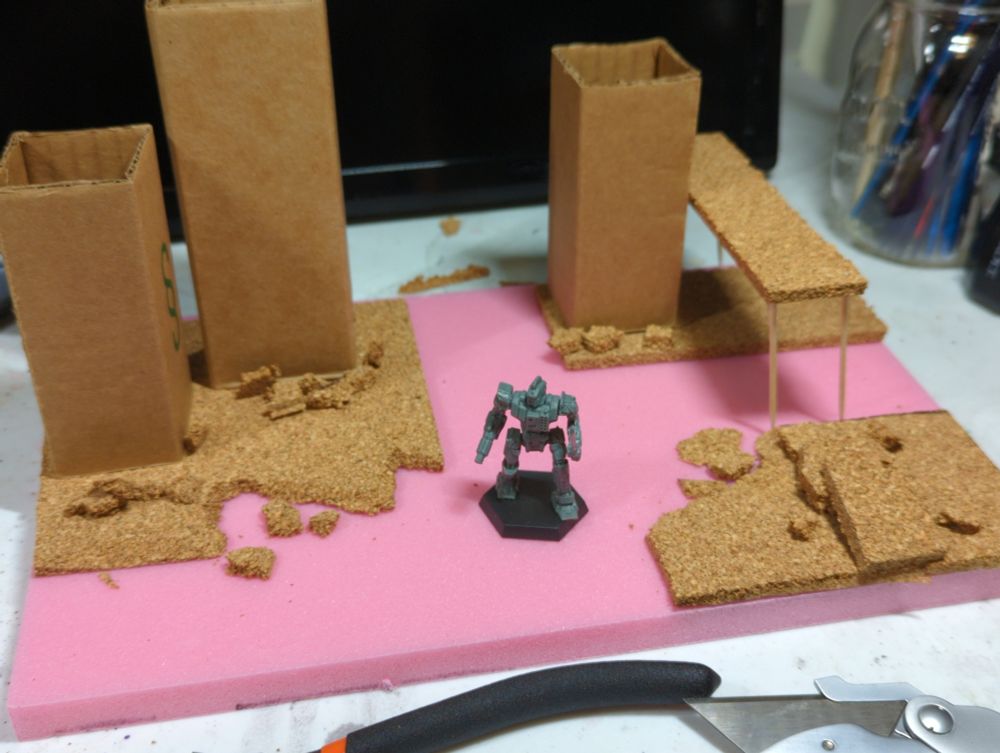 Urban terrain made from pink foam, cardboard and cork sheets. CGL Centurion model for scale.