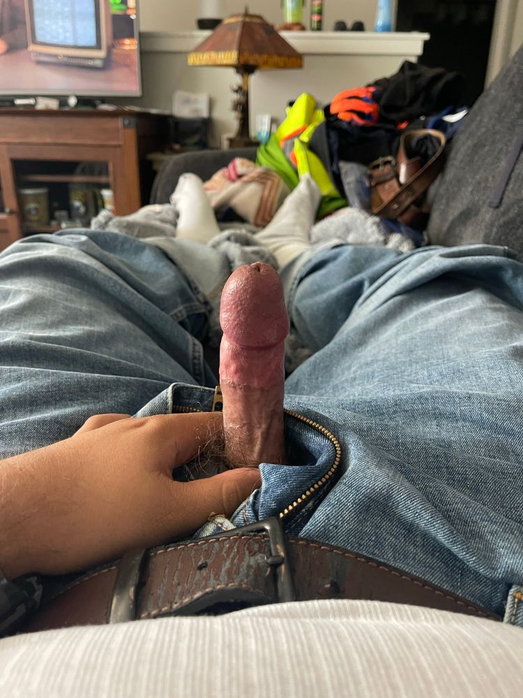 My hard cock sticking out through the fly of my light wash jeans