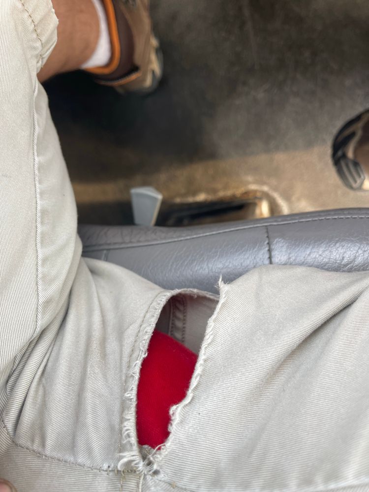 My shorts ripped and sitting manspread shows this. 