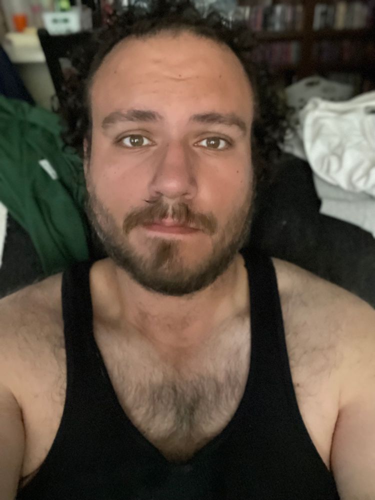 Me, try ng to look innocent in my black tank top