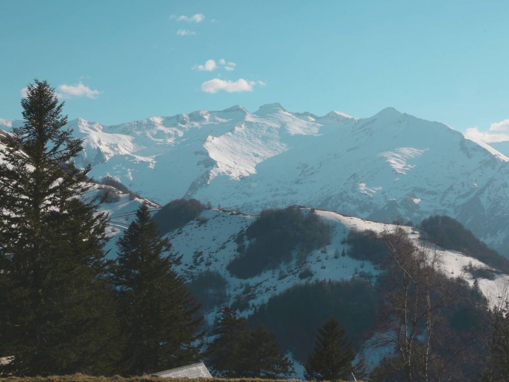 A view of the French Pyrenees, capped with snow.