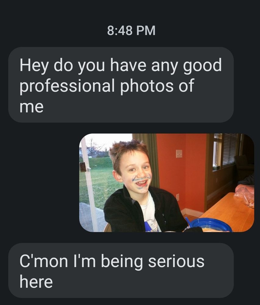 A picture of a young, professional, mustachioed man.