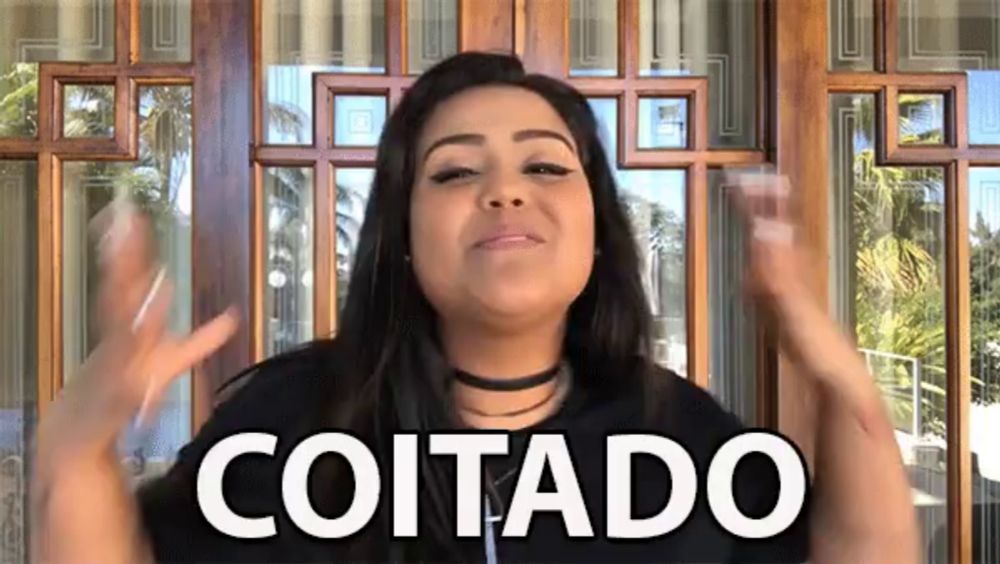 a woman stands in front of a wooden door with the word coitado on it