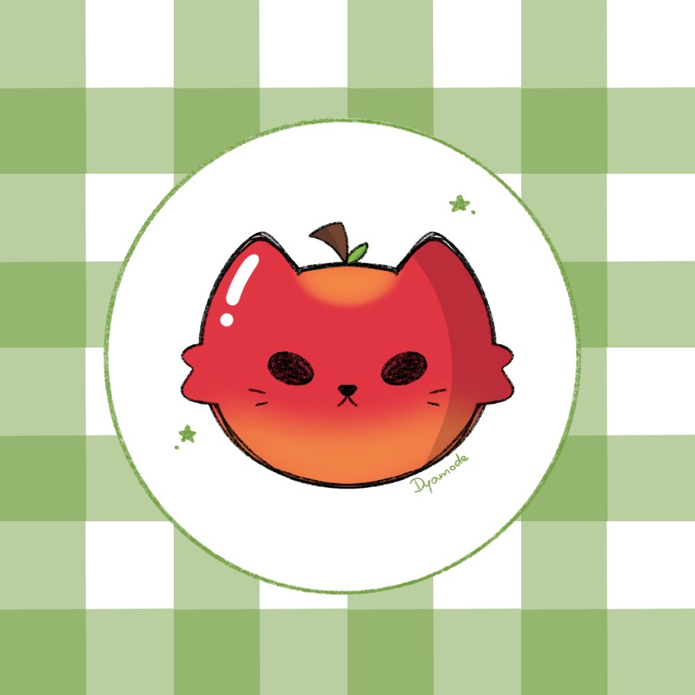 head of a cat that looks like a red apple, placed on a green plaid base