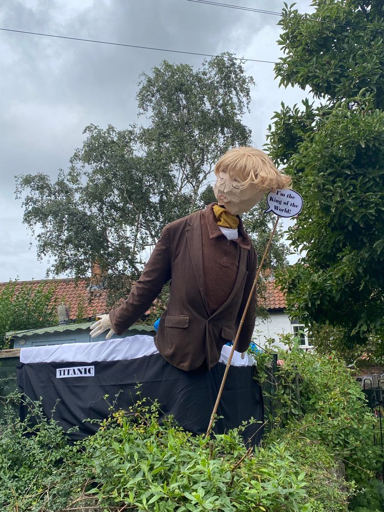A scarecrow of Jack on the helm of the Titanic. A speech bubble reads, ‘I’m king of the world!’