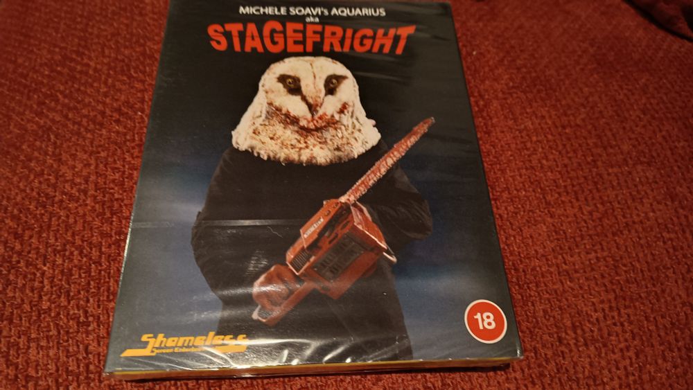 A copy of Stagefright, featuring a character in an owl mask welding a chainsaw on the cover 
