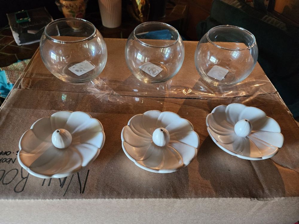 Three glass fishbowl candle holders and 3 white flower incense holders 