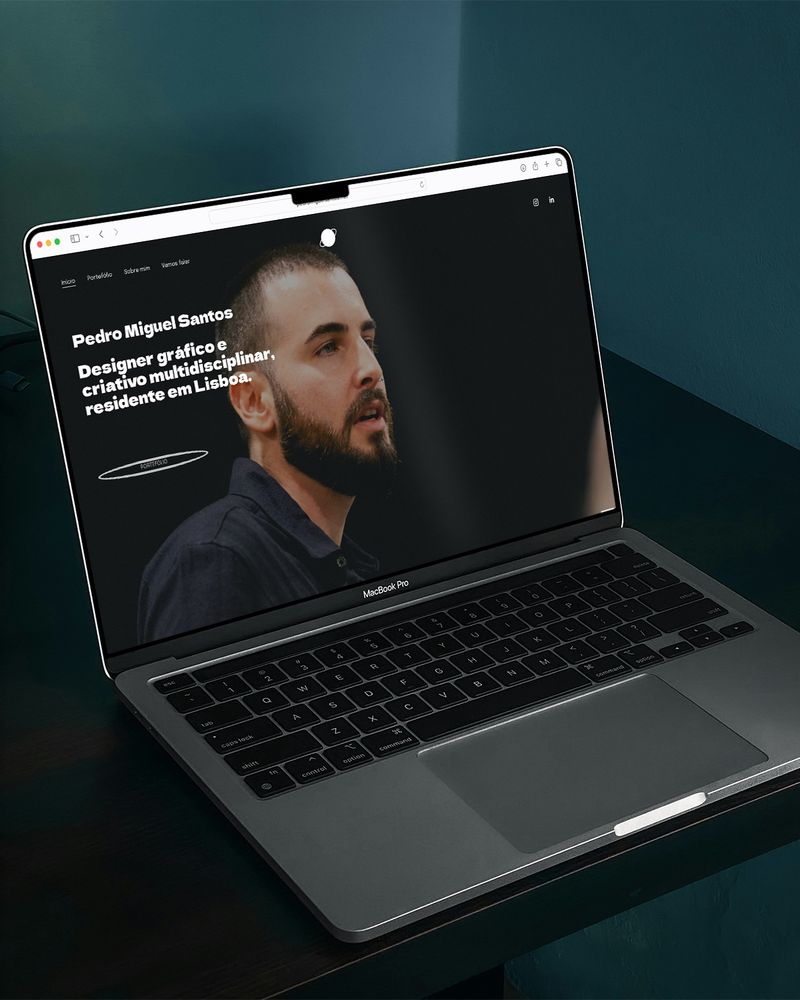 Website homepage on a laptop screen.