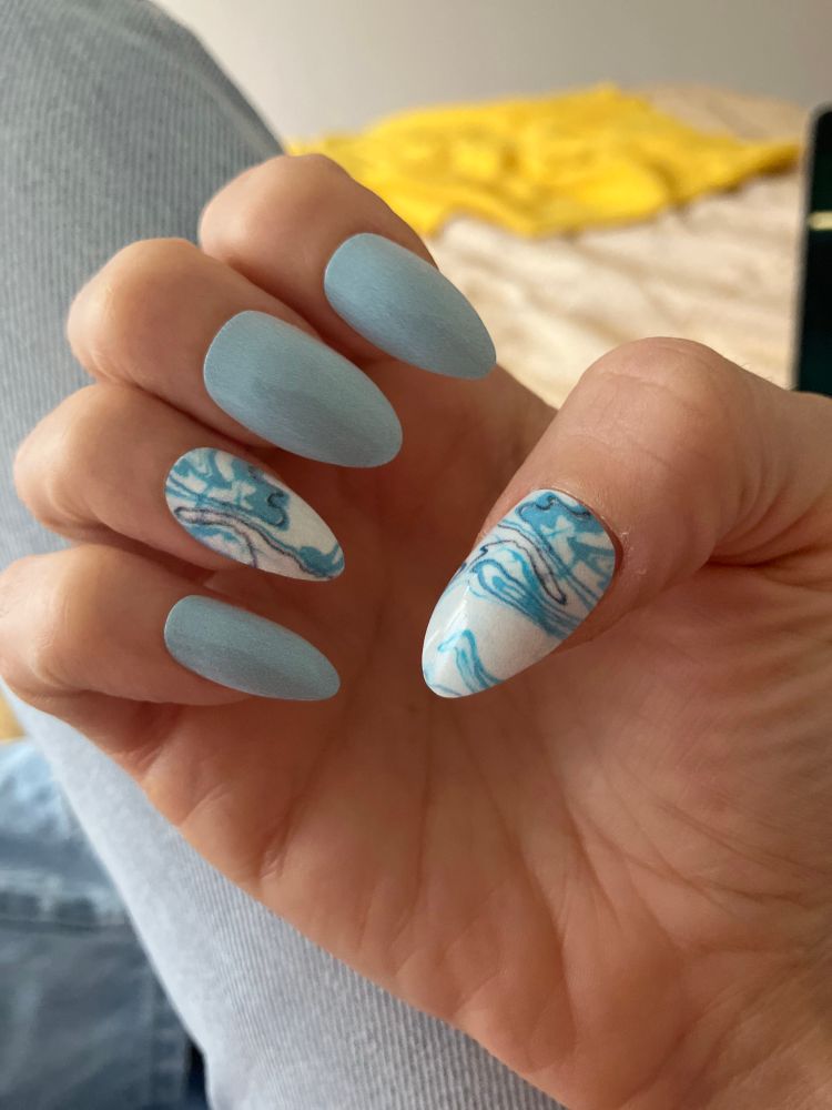 my nails. 3 are light blue but 2 of them are white with a turquoise and dark blue swirly pattern