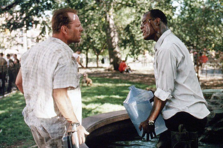 A scene from Die Hard 3, showing Detective John McClane and Zeus (played by Bruce Willis and Samuel L Jackson respectively) solving the water puzzle in the film.
