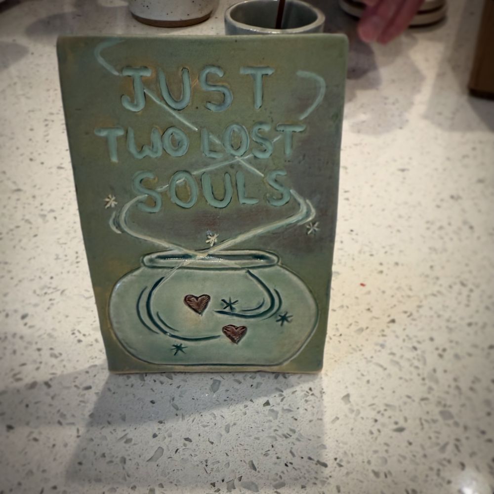 “Two lost souls” over carved fishbowl with two hearts swimming around. From Pink Floyd’s Wish you were Here. 