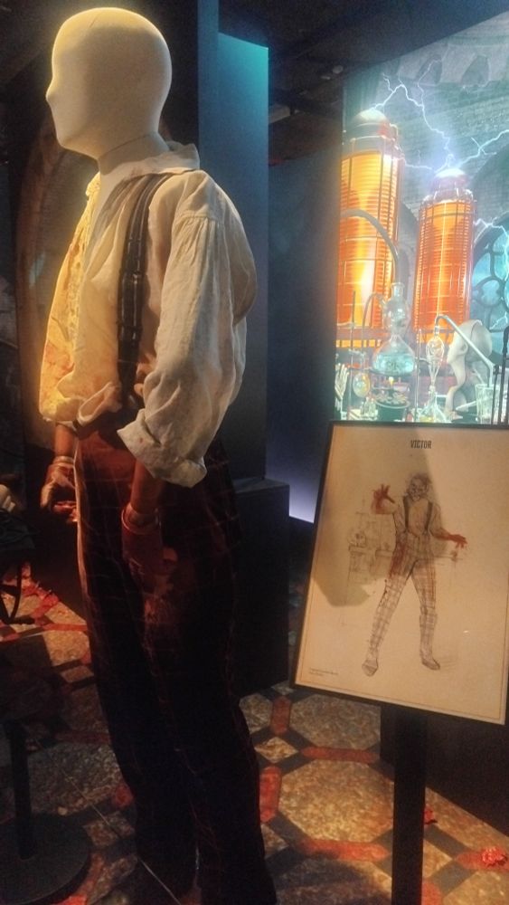 Sketch of Victor Frankenstein's costume next to the finished product 