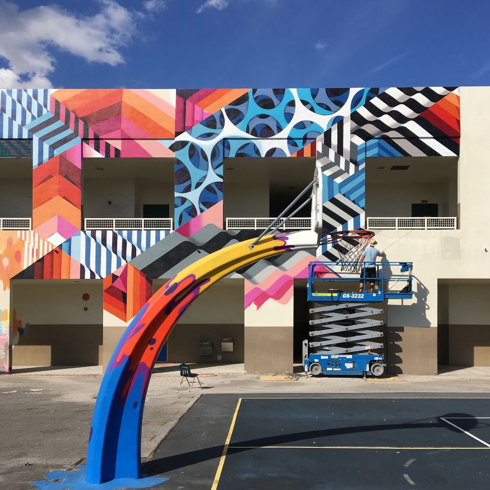 Artist Mr June paints a mural for the RAW Project in Wynwood in Miami, Florida.