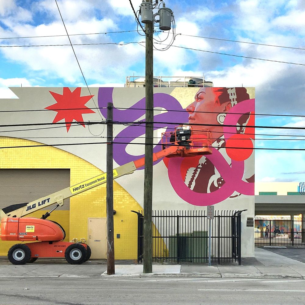 Artist Kevin Ledo paints a mural for the RAW Project in Wynwood in Miami, Florida.