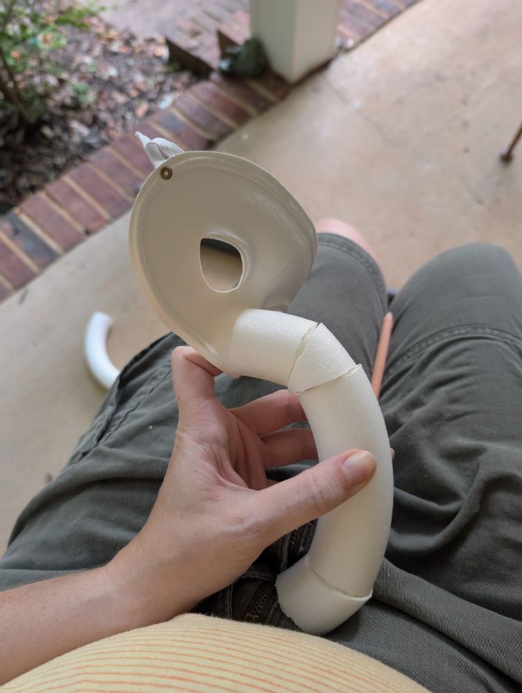 gonzo mask in progress made of segmented pieces of floral foam and a white masquerade mask