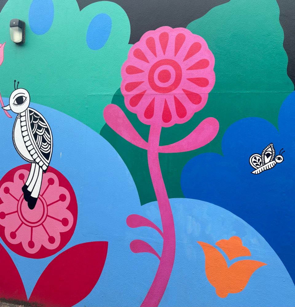 Colourful mural of bird, flower, and butterfly 