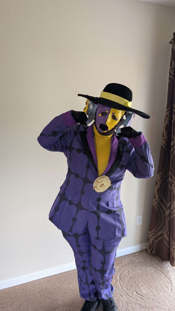 Change Agent from Toontown: Event Horizon making a mocking crying pose with the sad mask in front.