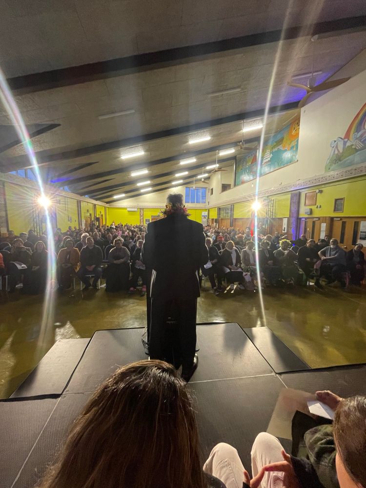 A photo from behind Ken at the launch today. He’s making a speech at the podium to a full house at Wainuiomata Marae. 