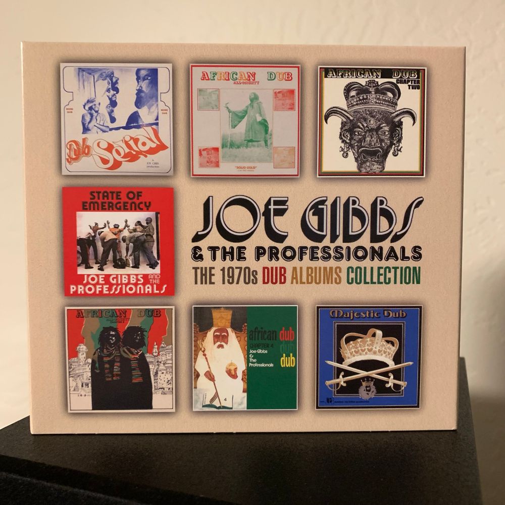 Joe Gibbs & the Professionals - The 1970s Dub Albums Collection 4CD set standing atop a speaker