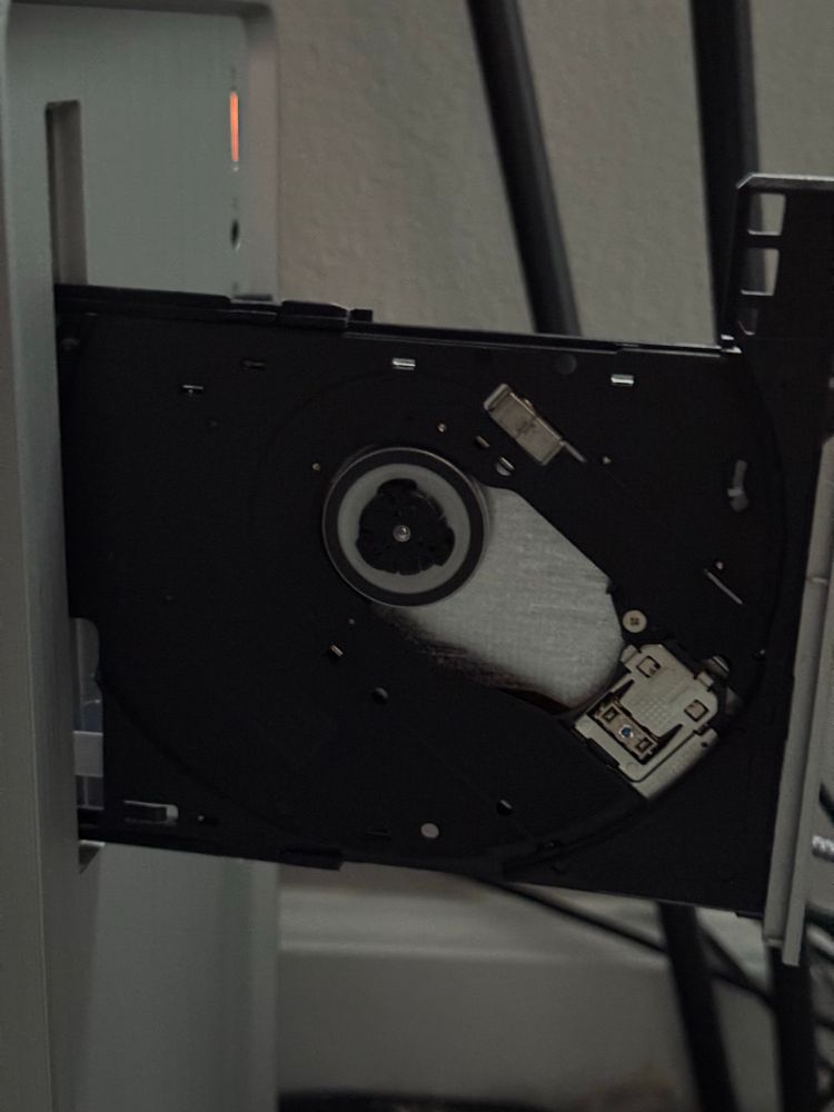 A DVDRW drive open and ready to ignite