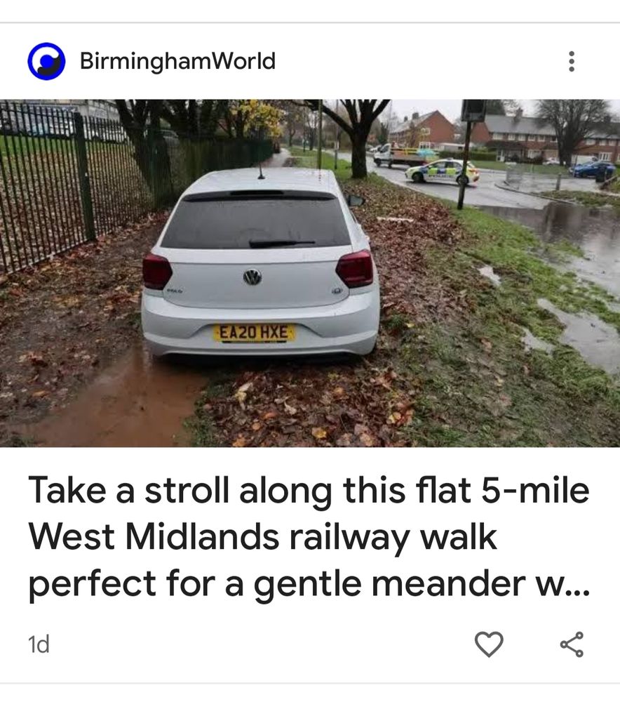 A photo of a car parked across a pavement next to a flooded road with a police car in the distance. Headline reads Take a stroll along this flat 5 mile west Midlands railway walk perfect for a gentle meander