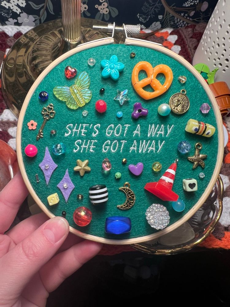 chaotic charm embroidery with lyrics from chappell roan’s song “the subway”: “she’s got a way, she got away”