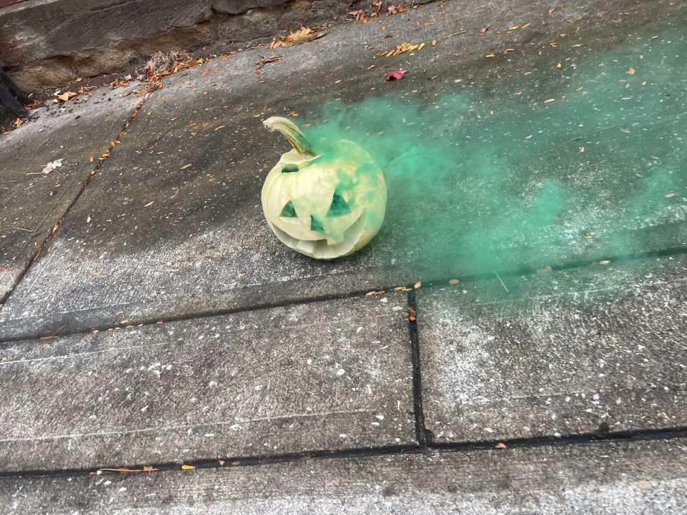 pumpkin with green smoke indicating a boy.