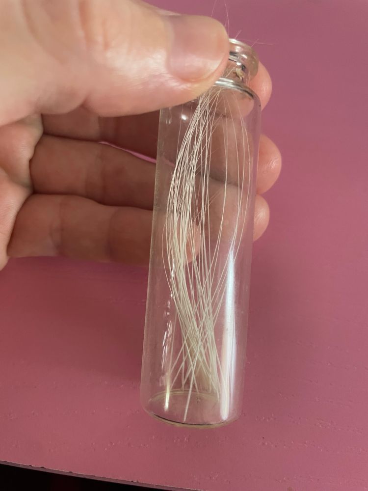 jar of white cat whiskers