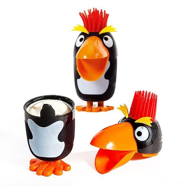 Photo of a Punky Penguin Ice Cream. It's a plastic ice cream container in the shape of a penguin and it has red rubbery / spiky hair ontop of its head. 